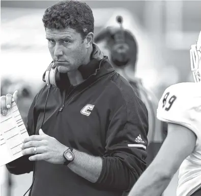  ?? STAFF PHOTO BY ROBIN RUDD ?? First-year UTC football coach Tom Arth, shown above during the Jacksonvil­le State game on Aug. 26, will lead his Mocs against LSU on Saturday.