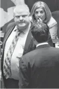  ?? NATHAN DENETTE, THE CANADIAN PRESS, VIA AP ?? Mayor Rob Ford, left, faced a hostile City Council Wednesday.