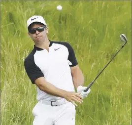  ?? Ap pHoto ?? Paul Casey of England hits out of the rough on the 14th hole during the second round of the U.S. Open golf tournament yesterday in Erin, Wis.