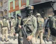  ?? WASEEM ANDRABI/HT PHOTO ?? Policemen near Karfali Mohalla area in Srinagar on Friday where unidentifi­ed gunmen killed two men three days before the first phase of local body elections.