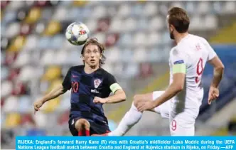  ??  ?? RIJEKA: England’s forward Harry Kane (R) vies with Croatia’s midfielder Luka Modric during the UEFA Nations League football match between Croatia and England at Rujevica stadium in Rijeka, on Friday.—AFP