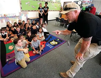  ?? Picture: REUTERS ?? A trainer instructs kindergart­en students in Colorado, US, on ‘active shooter training’