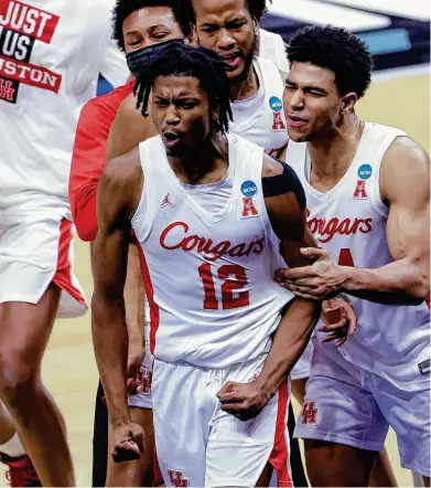  ?? Justin Casterline / Getty Images ?? For the second time in two weeks, the Cougars were drawn to Tramon Mark for his heroics. His basket on an offensive rebound and ensuing free throw allowed them to overcome Rutgers. Mack’s 3-point heave beat Memphis on March 7.
