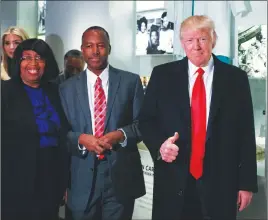  ?? AP PHOTO ?? President Donald Trump gives a thumbs up during a tour of the National Museum of African American History and Culture with Housing and Urban Developmen­t Secretary-designate Dr. Ben Carson and his wife Candy Carson yesterday in Washington.