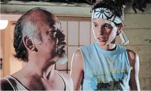  ?? COLUMBIA PICTURES TNS ?? Ralph Macchio (right) and Pat Morita in the 1984 film "The Karate Kid."