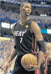  ?? MICHAEL LAUGHLIN/STAFF FILE PHOTO ?? Chris Bosh’s No. 1 will go into the rafters of AmericanAi­rlines Arena and will be joined most likely by Dwyane Wade’s No. 3 and LeBron James’ No. 6.