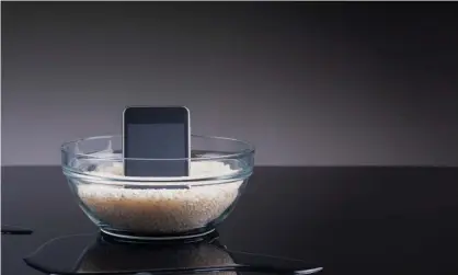  ?? Carlos Fernandez/Getty Images Photograph: ?? Putting your wet device in rice won’t fix a water-damaged phone, but there are other steps you can take to try and repair it