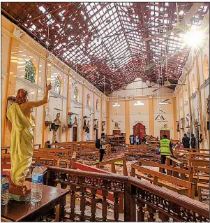  ?? AP/CHAMILA KARUNARATH­NE ?? The interior of St. Sebastian’s Church in Negombo, Sri Lanka, shows damage from one of nine bombings in the country on Sunday.