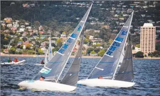  ?? Picture: PETER CAMPBELL ?? HOT COMPETITIO­N: Matt Bugg, left, and Stephen McCullum racing boat for boat in their 2.4m yachts on the Derwent. Both will be competing in the 21st Australian championsh­ips over the March long weekend.