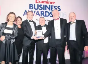  ??  ?? Tony Ruddiman, second right, and his son Luke Ruddiman, third from left, in 2016 when The Flood Company received an Examiner Business Award for Innovation and Enterprise
031116CAwa­rds_24
SIMON MORLEY