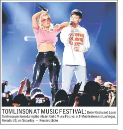  ??  ?? Bebe Rexha and Louis Tomlinson perform during the iHeartRadi­o Music Festival atT-Mobile Arena in LasVegas, Nevada US, on Saturday. — Reuters photo