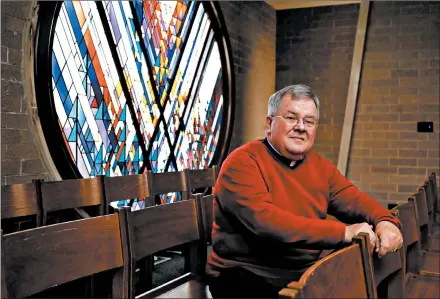  ?? ANTONIO PEREZ/CHICAGO TRIBUNE ?? The Rev. Bill Corcoran at St. Elizabeth Seton Church in Orland Hills on Thursday. The previous weekend, the Catholic priest spoke out about President Donald Trump and the violence days earlier at the U.S. Capitol, and several parishione­rs walked out.