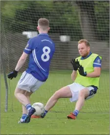  ??  ?? Paul Campbell makes a great save for the Mairtins against O’Connell’s.