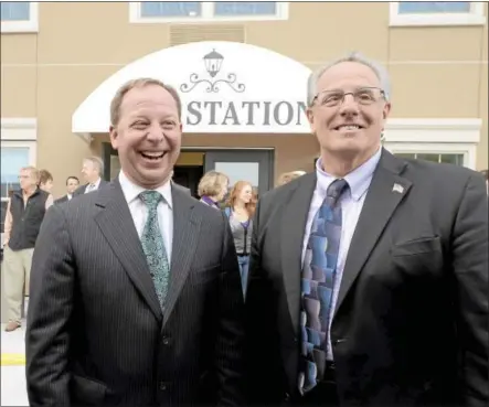  ?? RECORD FILE PHOTO ?? Michael Uccellini, left, president and CEO of the United Group of Companies, and Troy Mayor Lou Rosamilia celebrate the opening of College Suites at City Station East on Oct. 16, 2013.