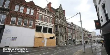  ??  ?? Boarded-up shopfronts in Market Street, Nottingham