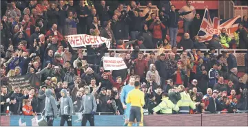  ??  ?? Arsenal fans hold up banners protesting against manager Arsene Wenger. — Reuters photo