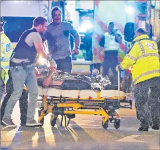  ??  ?? OUTRAGE: Emergency services rush to the aid of a London Bridge attack victim