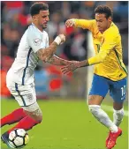  ??  ?? Brazil’s Neymar tries to find a way past England’s Kyle Walker.