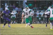  ?? PHOTO BY JERRY BALLENGEE ?? St. Charles senior quarterbac­k Marlon Brown scrambles for running room in Friday night’s 35-6 loss to the Lackey Chargers in a SMAC nondivisio­n football contest in Indian Head. Brown completed 10 of 18 passes for 97 yards in the game.