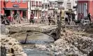  ?? Photograph: Sascha Steinbach/EPA ?? Residents clear debris after heavy flooding of the River Erft caused severe destructio­n in the village of Bad Münstereif­el, Euskirchen district, Germany on 20 July.