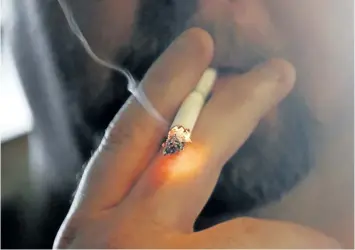  ?? THE ASSOCIATED PRESS FILES ?? The federal government is proposing a ban on smoking on college campuses or inside condo and apartment buildings.