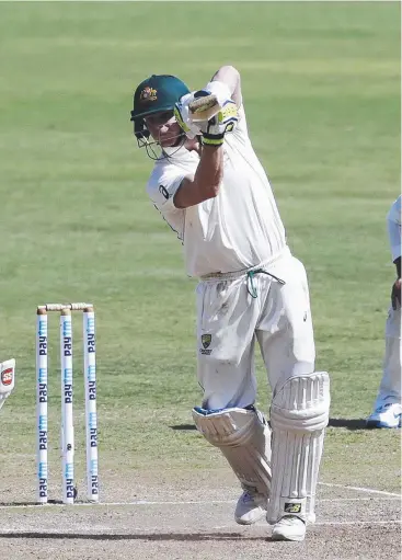  ?? Picture: AP ?? CLASSY KNOCK: Australia’s captain Steve Smith shows his skill as he belts another ball to the boundary during the third day of the first Test against India in Pune.