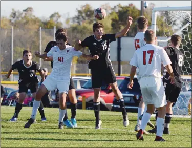  ?? OWEN MCCUE - MEDIANEWS GROUP ?? Boyertown’s Kolby Houck (15) wins a header Thursday over Pennsbury’s Joshua Panaro (41).