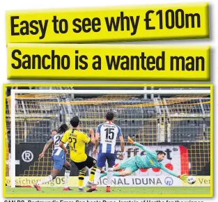  ??  ?? CAN DO: Dortmund’s Emre Can beats Rune Jarstein of Hertha for the winner