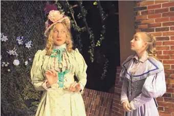  ?? COURTESY OF SF PLAYHOUSE ?? Christina Comer is Gwendolen Fairfax and Triana Reid plays Cecily Cardew in Oscar Wilde’s “The Importance of Being Earnest,” which continues its run at the Santa Fe Playhouse.