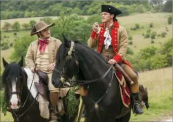  ?? LAURIE SPARHAM/DISNEY VIA AP ?? This image released by Disney shows Josh Gad as Le Fou, left, and Luke Evans as Gaston in a scene from, “Beauty and the Beast,” opening nationwide on March 17.