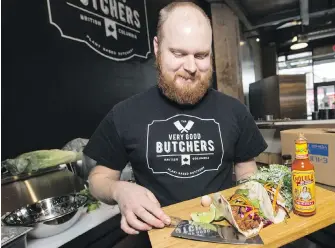  ?? DARREN STONE, TIMES COLONIST ?? James Davison prepares vegan tacos at Very Good Butchers at the Hudson.