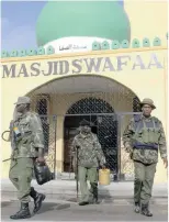  ?? PICTURES: EPA ?? CRACKDOWN: Kenyan police arrest Muslim youths at a mosque in the coastal city of Mombasa, Kenya, on Monday. Police conducted dawn raids on several mosques, recovering weapons and arresting scores of alleged supporters of alShabaab, Somalia’s Islamist...