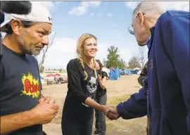  ?? Gary Coronado Los Angeles Times ?? JUDGE David Carter, here at a homeless camp, has pushed Orange County to act.