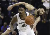  ?? ROD AYDELOTTE — THE ASSOCIATED PRESS ?? Baylor guard Davion Mitchell, left, breaks away from West Virginia guard Jermaine Haley for a fast break in the second half on Saturday in Waco, Texas.