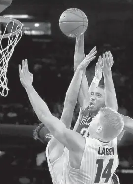  ?? Julie Jacobson Associated Press ?? VILLANOVA’S Mikal Bridges goes up for a dunk against Gonzaga’s Killian Tillie, left, and Jacob Larsen. Bridges scored 28 points in the Wildcats’ victory.