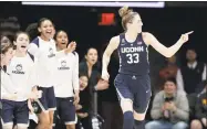  ?? Tony Gutierrez / Associated Press ?? UConn’s Katie Lou Samuelson celebrates a 3-point basket during the second half.