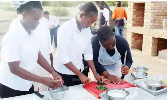  ?? ?? FIXING A HOT PLATE: Some of the Chefs in action