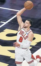  ?? / AP
BEN MARGOT ?? Zach LaVine goes up for a dunk against the Hawks during the first half Friday in Atlanta. LaVine scored a career-high 50 points, but the Bulls lost 120-108.