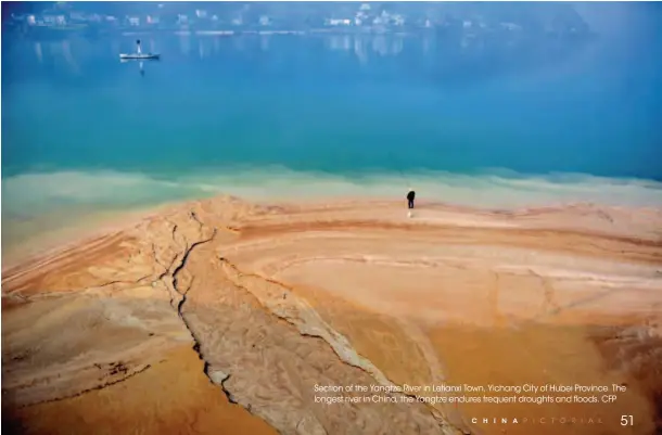  ??  ?? Section of the Yangtze River in Letianxi Town, Yichang City of Hubei Province. The longest river in China, the Yangtze endures frequent droughts and floods. CFP