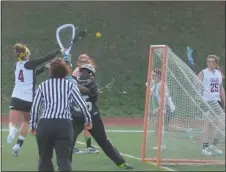  ?? STAFF PHOTO BY ANDY STATES ?? North Point’s Ali Zadeh scores one of her six goals late in the first half of the Eagles’ game with the visiting Patuxent on Wednesday night. Patuxent won 14-9.