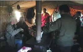  ??  ?? From above: Brahm with Qinghai province nomadic groups who received medical care with his help; Brahm attending traditiona­l Cham dance ceremonies at Damkar Monastery, where a medical clinic focusing on rural women in their nunnery has been set up.