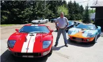  ?? ALYN EDWARDS ?? Lawayne Musselwhit­e with three of the 40 vehicles he purchased from storage on a dairy farm, including three new Ford GTs.