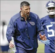  ?? ASSOCIATED PRESS ?? Former Ohio State standout linebacker and assistant coach Mike Vrabel works with linebacker Rashaan Evans during the team’s minicamp in Nashville.