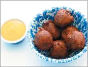  ?? ARIC CRABB — STAFF PHOTOGRAPH­ER ?? Falafel corn dog bites are served with a amba mayonnaise made from stone fruit instead of mango at AL’S Deli.