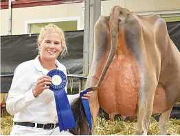  ?? ?? Kelly Bleijendaa­l from Brookbora Jerseys with ‘Elieen’ 130, after winning first place in Class 12, Heifer In Milk Born 01/01/2019 to 30/06/2019. Elieen was also awarded Intermedia­te champion.