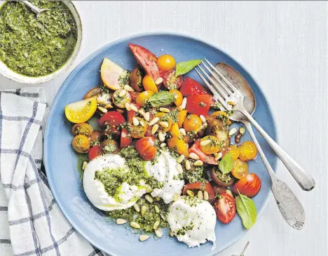  ??  ?? Heirloom tomato salad with burrata, from Jennifer Segal’s Once Upon a Chef, pairs nicely with an off-dry rose wine.