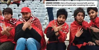  ?? ?? UNDER COVER: Zahra Khoshnavaz (second left) and her fellow female fans got arrested after sneaking into a game