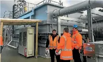  ?? PHOTO: KAROLINE TUCKEY/STUFF ?? Downer water plant engineers stand in front of the new clarifier at the Levin Water Treatment Plant.