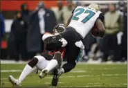  ?? RON SCHWANE — ASSOCIATED PRESS ?? Jason McCourty tackles Jaguars running back Leonard Fournette during the first half Nov. 19.