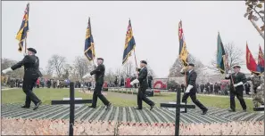  ?? PICTURE: PA WIRE ?? MARCH: Royal British Legion standard bearers at the opening of the Field of Remembranc­e.